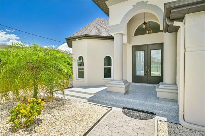 Property entrance featuring french doors