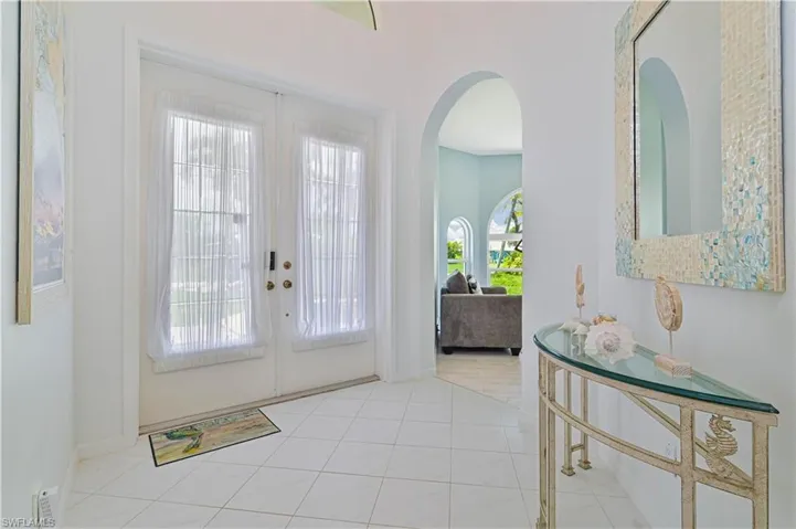 Tiled entryway with french doors