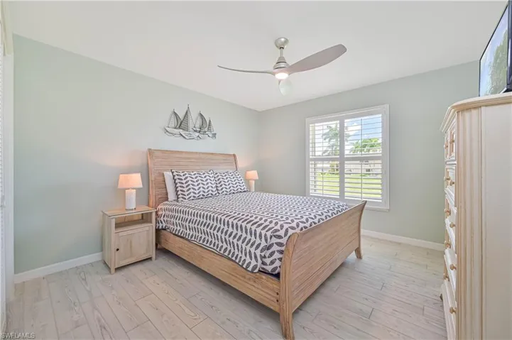 Bedroom featuring light hardwood / wood-style flooring and ceiling fan