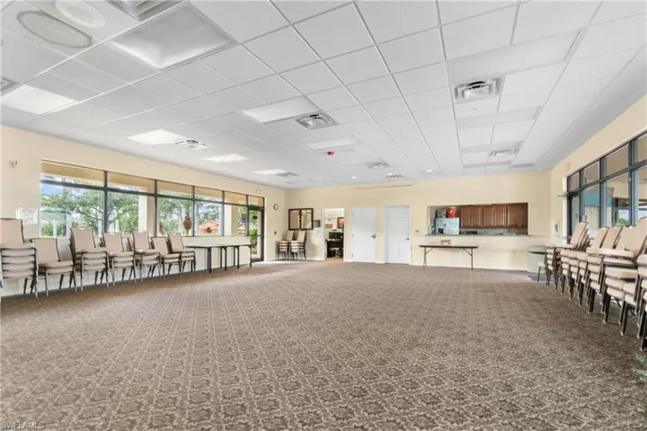Misc room featuring carpet flooring and a drop ceiling
