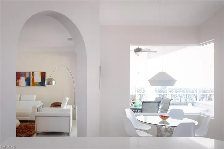 Tiled dining area featuring ceiling fan