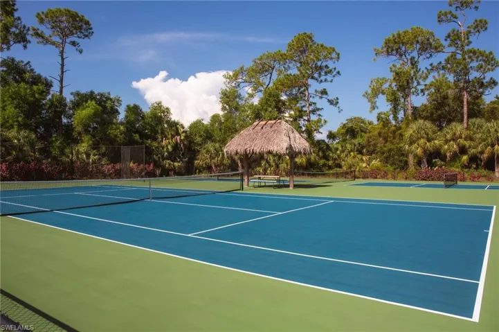 View of tennis court featuring a gazebo