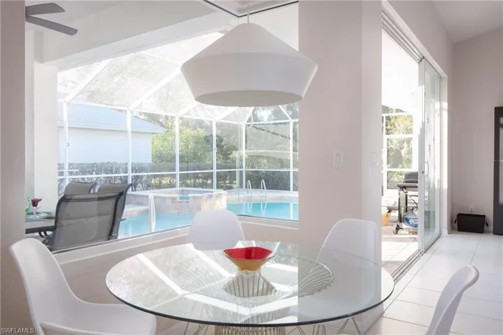 Dining room with light tile patterned floors