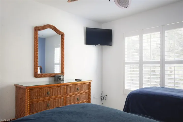 Bedroom with multiple windows