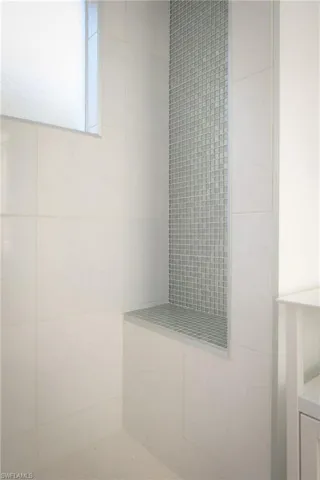Bathroom with tiled shower
