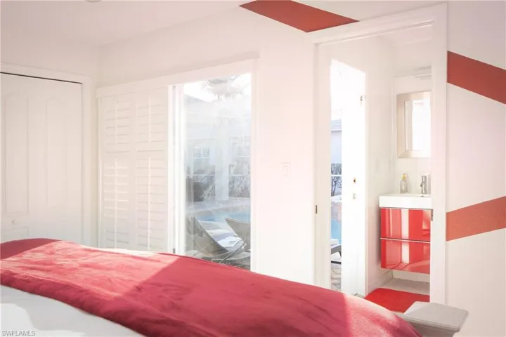 Bedroom with sink and access to exterior