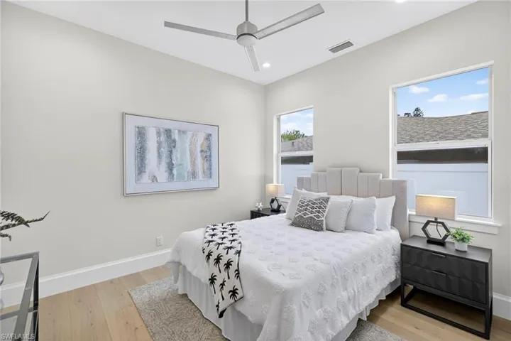 Bedroom featuring light wood finished floors, recessed lighting, and ceiling fan