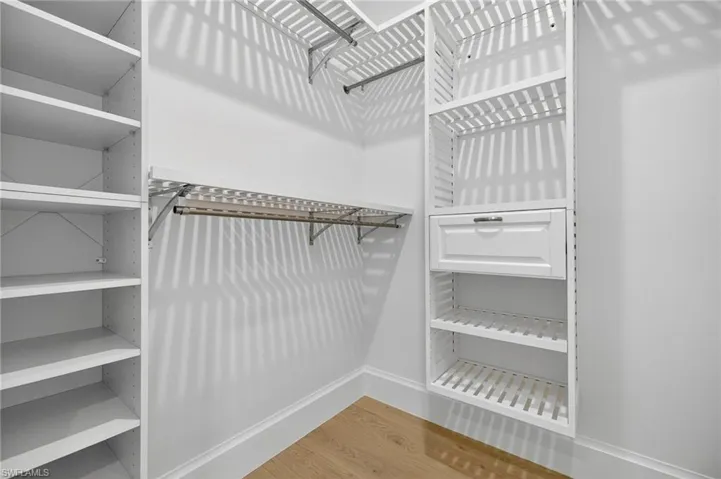 Walk in closet featuring light wood finished floors
