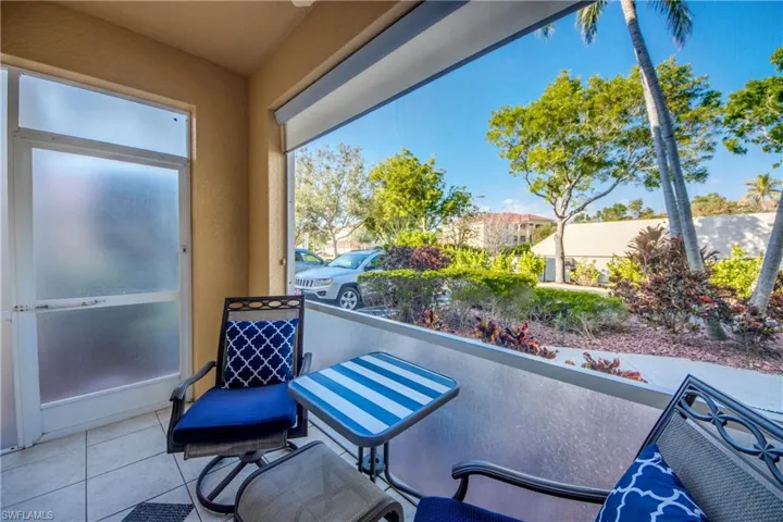 Patio looks over mature manicured landscaping