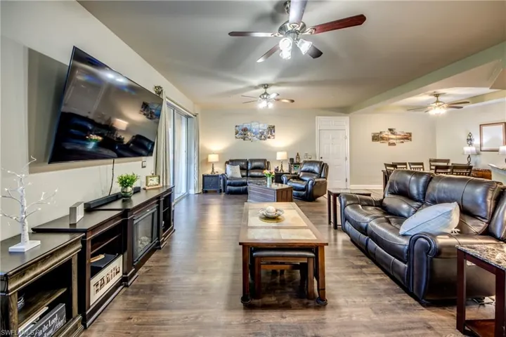 Living Room with TV open to kitchen