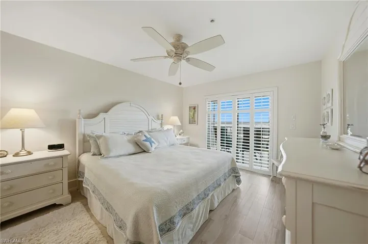 Primary Bedroom with Plantation Shutters, Tile Flooring and Ceiling Fan, Dual Closets