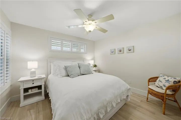 2nd Bed with Plantation Shutters, Tile Flooring, and Ceiling Fan