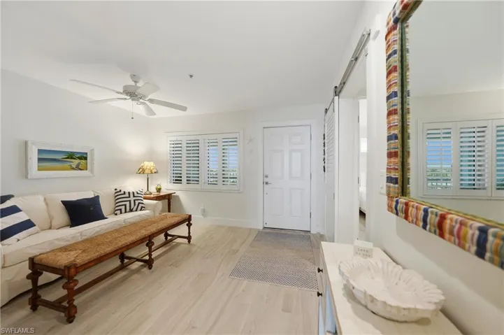 Den with Plantation Shutters, Tile Flooring, Ceiling Fan