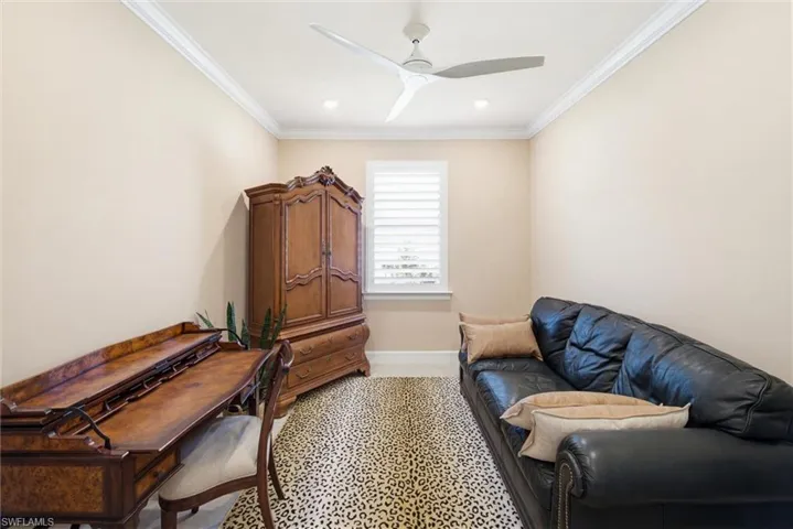 Office area featuring ornamental molding, a ceiling fan, and recessed lighting