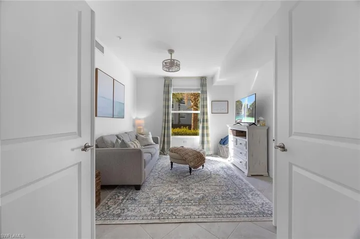 Sitting room featuring light tile patterned floors