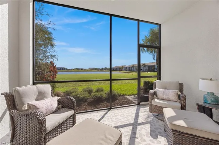 Sunroom / solarium featuring a water view and an outdoor hangout area