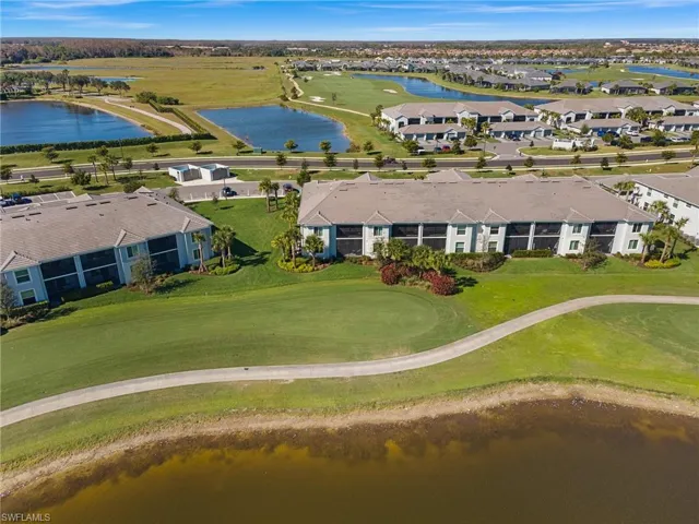 Bird's eye view of a nearby body of water and a local golf course