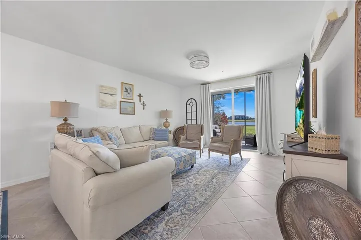 Living room featuring light tile patterned floors