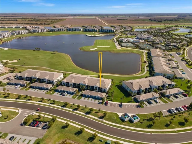 Aerial overview of property's location with a nearby body of water and nearby suburban area
