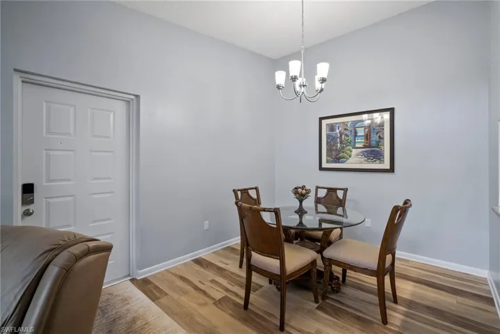 Dining area featuring a chandelier and hardwood / wood-style floors