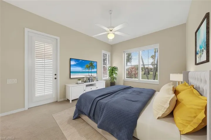 Comfortable Master Bedroom with golf course views and access to the screened lanai.