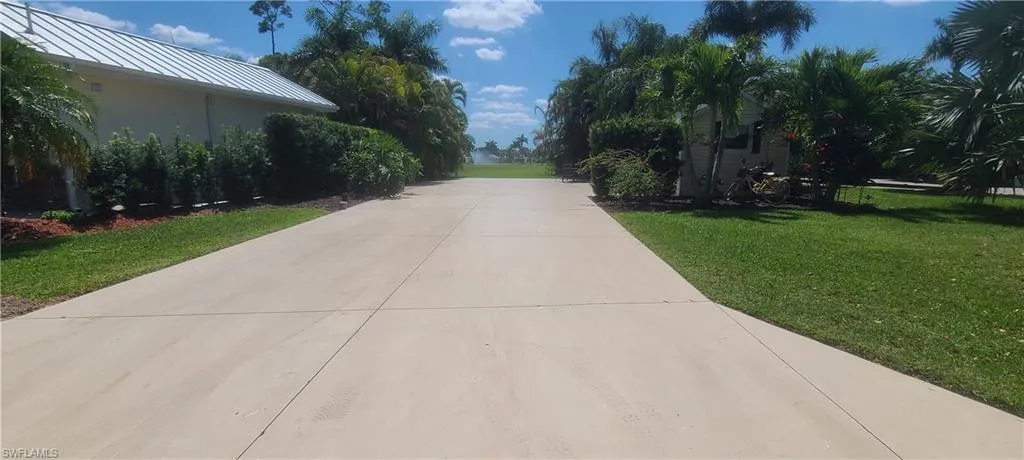View of street featuring concrete driveway