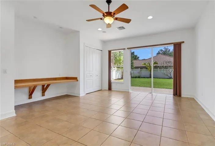 Large bedroom with custom bamboo desk and access to fenced yard area. Would also make a great study or play room.