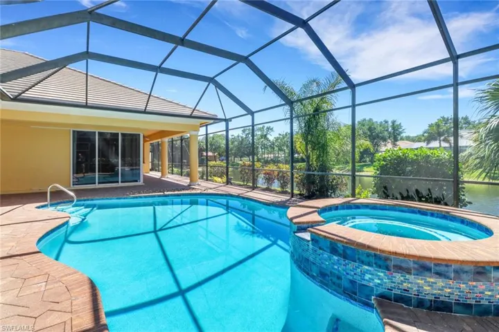 Newly added spa with waterfall over heated pool.