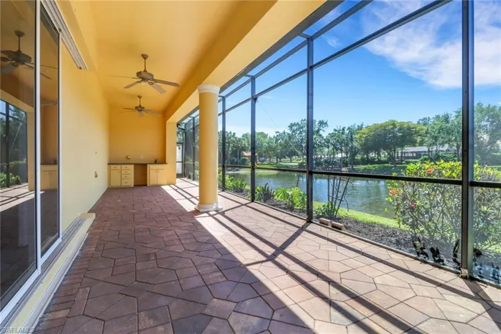 Lots of screened and covered space leading to outdoor kitchen area.