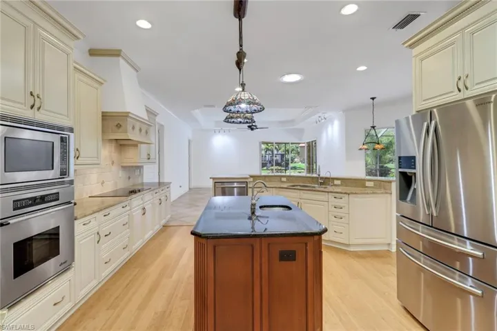 Enjoy beautiful pool views and lots of natural lighting in kitchen.