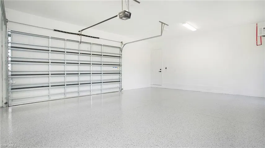 Garage featuring a garage door opener