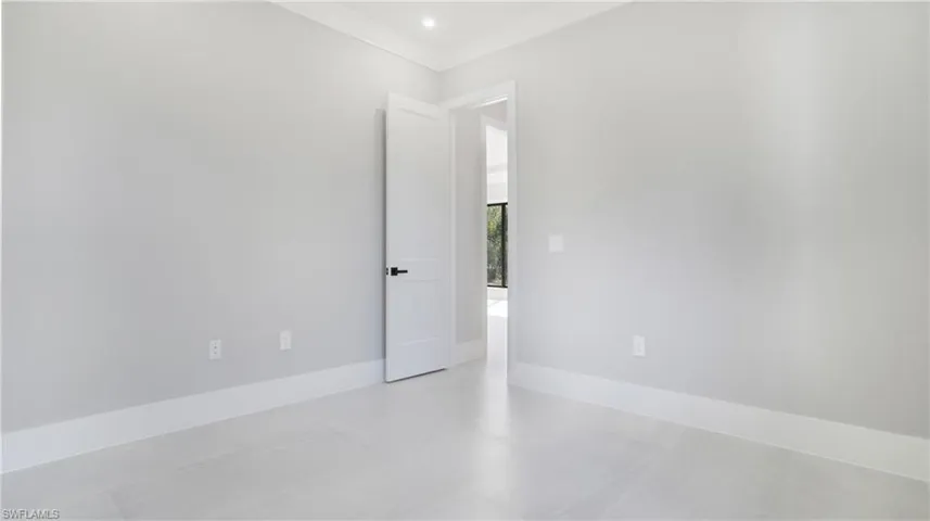 Unfurnished room featuring crown molding and recessed lighting