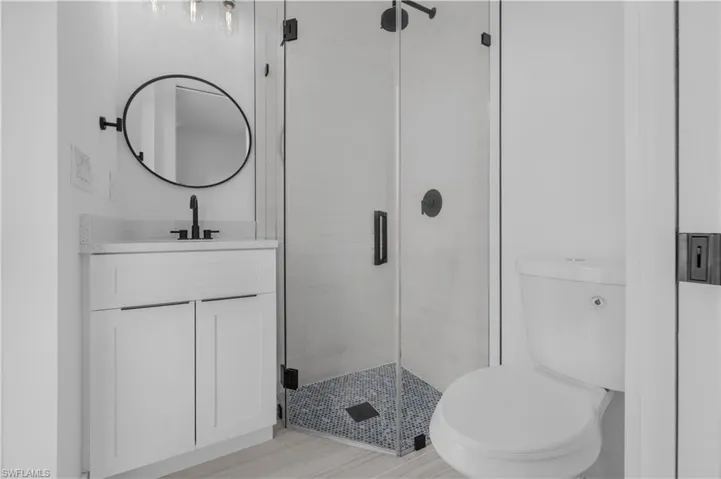 Bath room mother in law with vanity and a shower stall