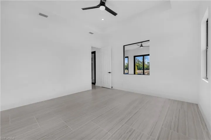 Unfurnished master  bedroom with ceiling fan and recessed lighting
