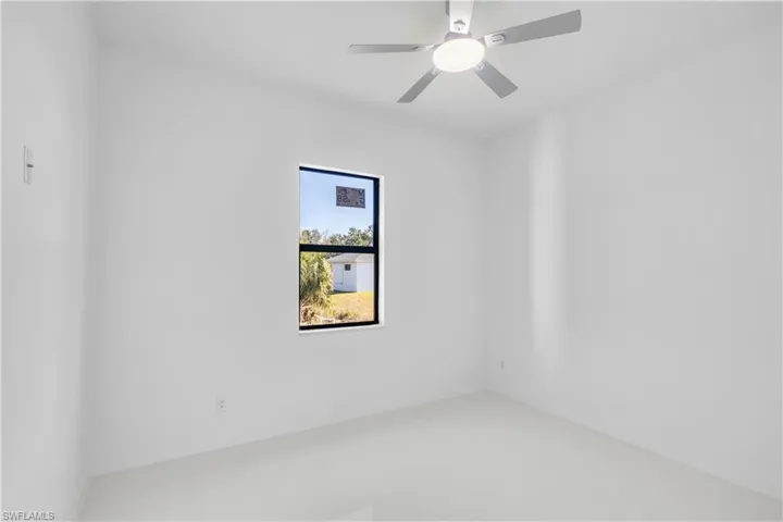 Spare room with ceiling fan