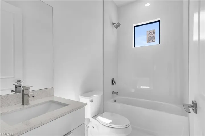 Full bathroom featuring vanity and  shower combination