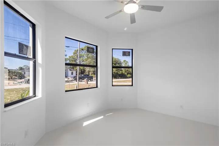 Empty room featuring ceiling fan