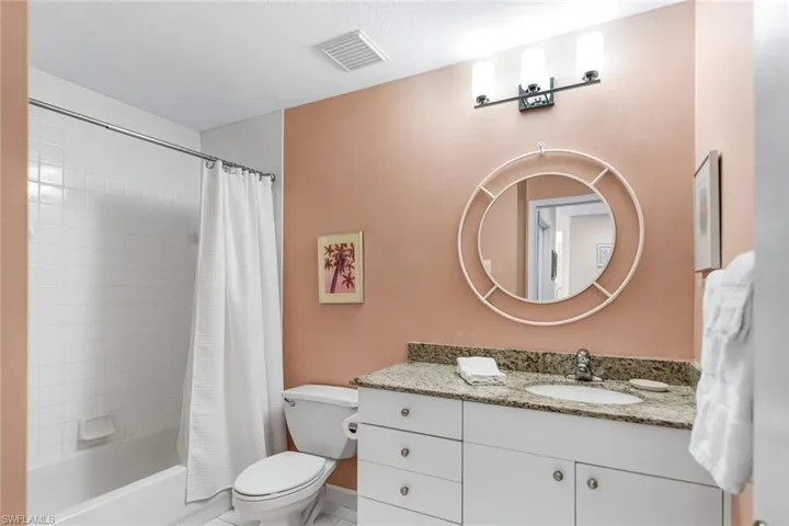 2nd Bath w/ Granite-Topped Vanity & Floor-to-Ceiling Tiled Tub-Shower