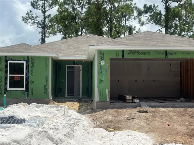 Property in mid-construction with a garage