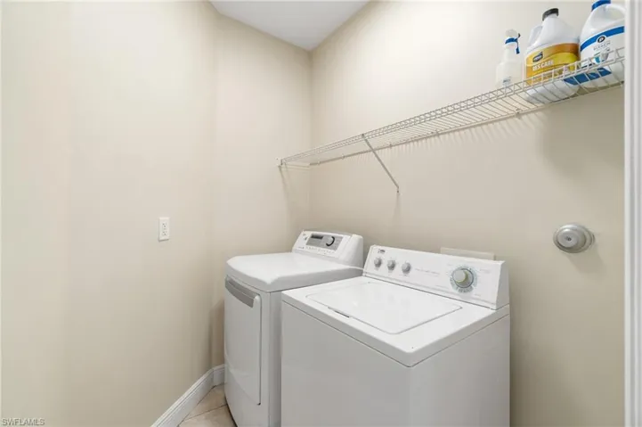 Laundry room conveniently located in residence.