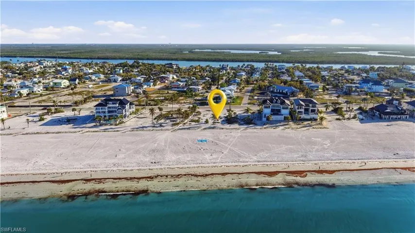 Aerial perspective of suburban area featuring a nearby body of water - Virtually Edited Image