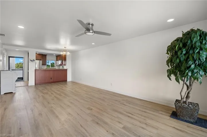 Living room with new ceiling fan & recessed lighting