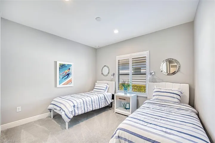 Bedroom featuring carpet and recessed lighting