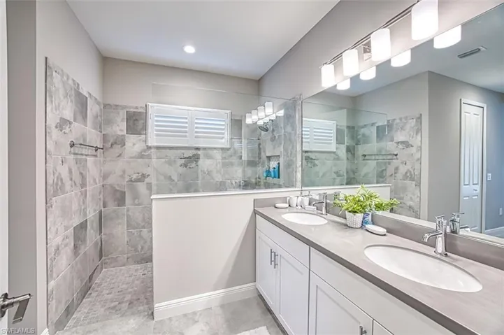 Bathroom with walk in shower and double vanity