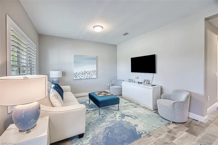 Living room with wood finished floors and baseboards