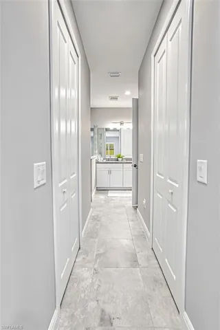 Corridor featuring baseboards