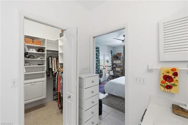 Walk in closet serving primary bedroom
