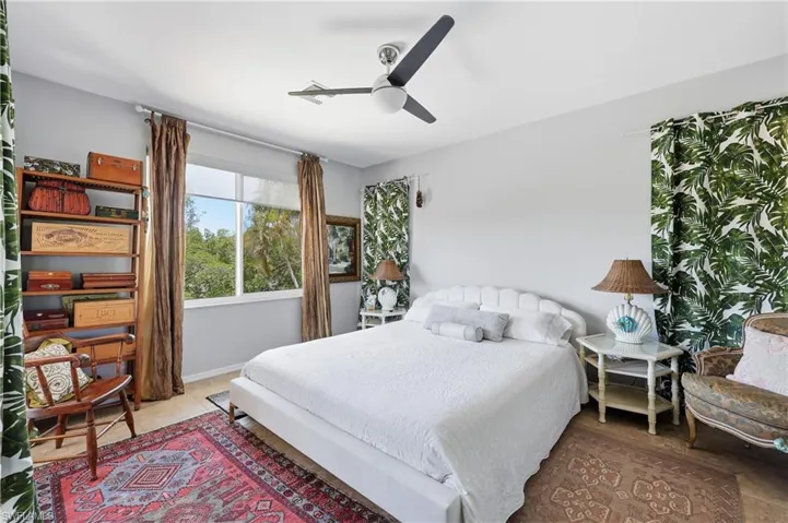 Primary bedroom overlooks the water
