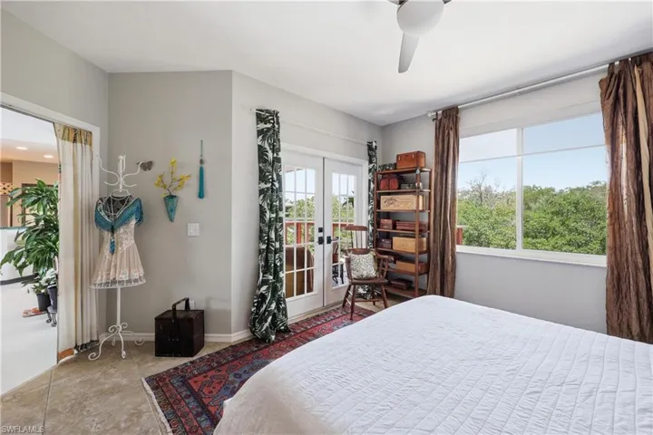 Primary bedroom has French doors to the lanai