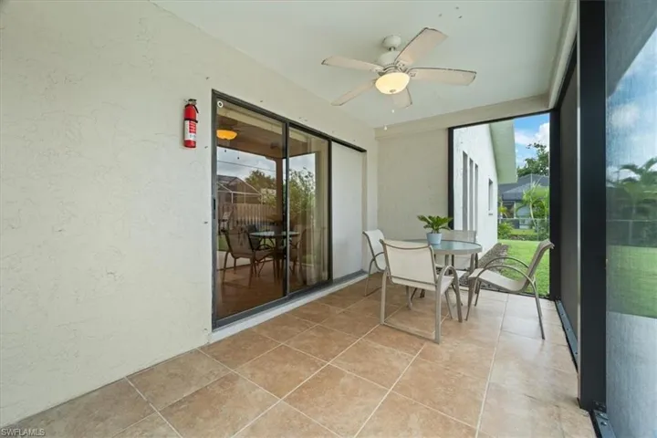 Sunroom featuring ceiling fan
